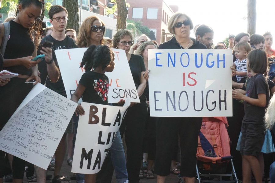 Evanston community members gather at Fountain Square to protest recent police brutality cases across the nation. The Black Lives Matter demonstration was set up by a group of ETHS graduates. 