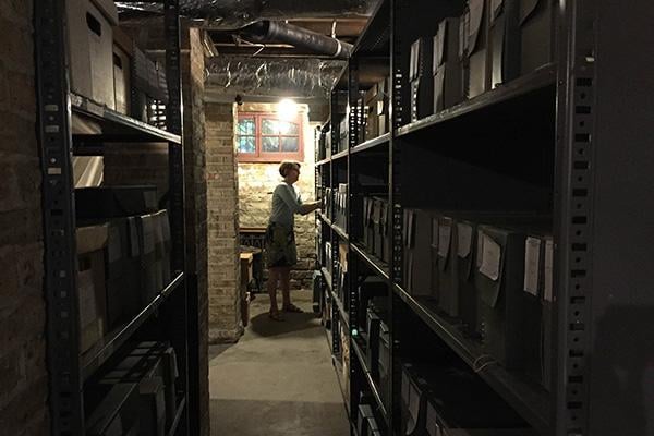 Lori Osborne searches through files of historical records in the basement of Evanston’s Charles Gates Dawes House. She has worked as the Evanston History Center archivist for 10 years.