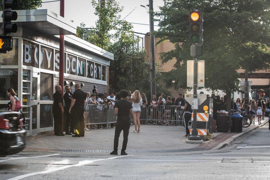 Fans wait in line to grab copies of Frank Oceans new album, Blonde. Fans flocked to the Chicago-Main Newsstand after it was announced there would be a pop-up shop located there giving away free copies of the album.
​​