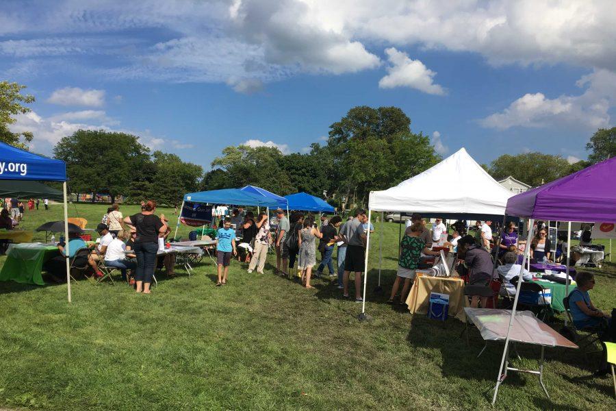 Residents and Community members gather at Twiggs Park for the Fifth Ward Festival. The festival featured information booths in addition to food vendors and entertainment acts to help promote the end of gun violence.
