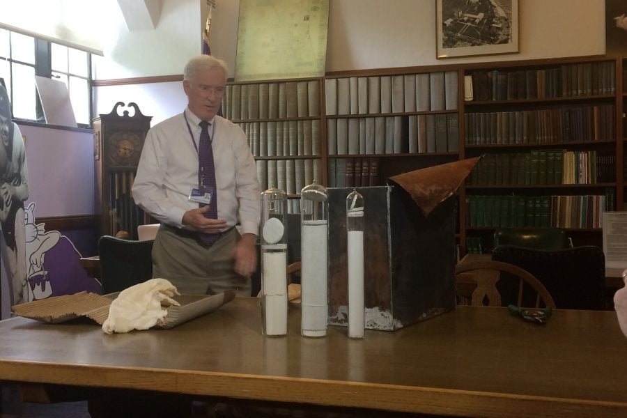 University Archivist Kevin Leonard unveils three glass containers found inside the Kresge Hall time capsule. The documents included a Daily Northwestern article from 1953.