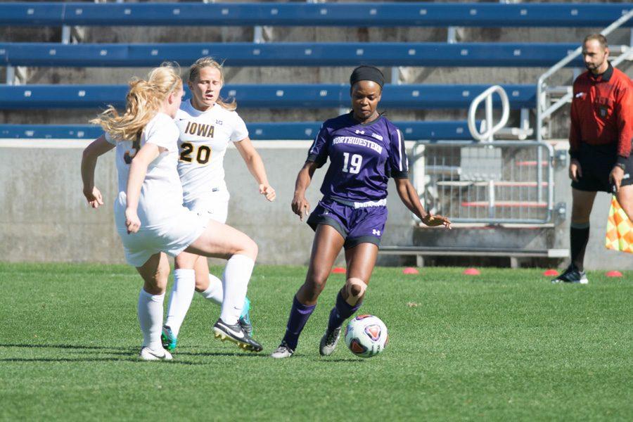 Kourtney Scott avoids a defender. The senior defender and the Wildcats hit the road this weekend in search of a signature win after a 9-0-0 start to the season.