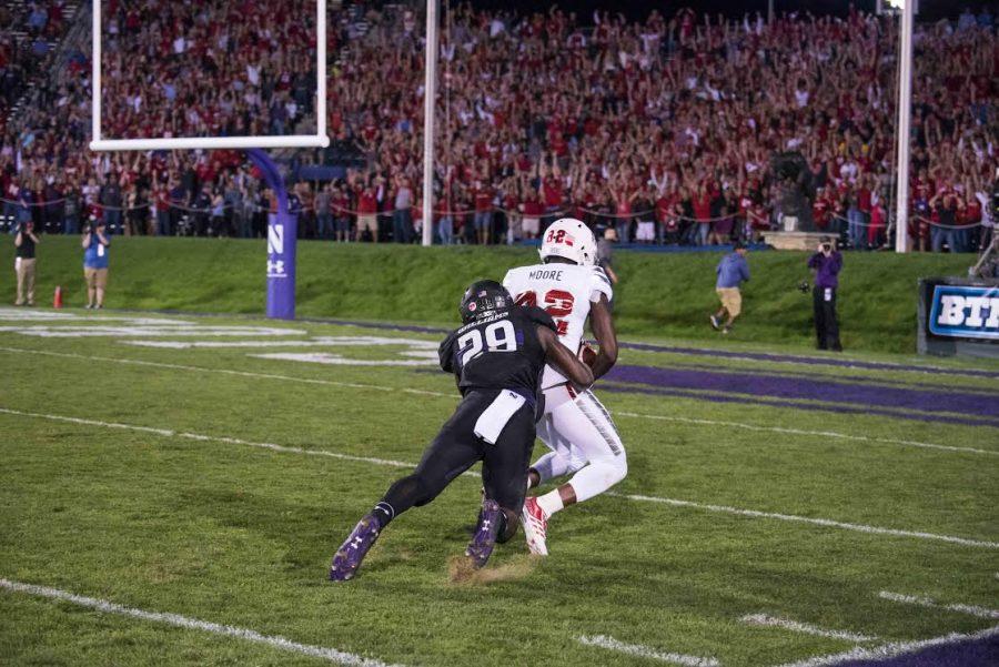 Trae Williams tackles Nebraska receiver Alonzo Moore moments after he caught a 59-yard pass. Northwestern gave up 556 yards of total offense Saturday.