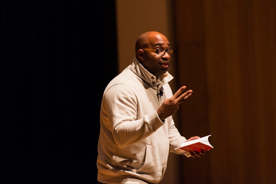 Children’s book author and poet Kwame Alexander speaks at Evanston Township High School on Friday. Alexander said at the event poetry was a powerful tool of communication. 