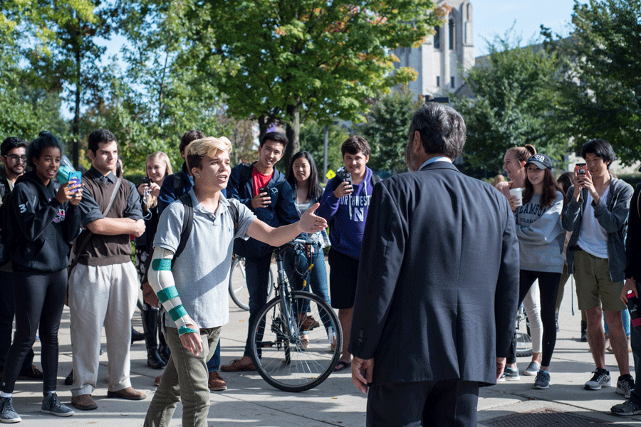Weinberg freshman Michael Iverson debates with The Campus Ministry USA president Jed Smock during a demonstration at The Arch Monday. The religious organization visited NU while touring college campuses around the country. 