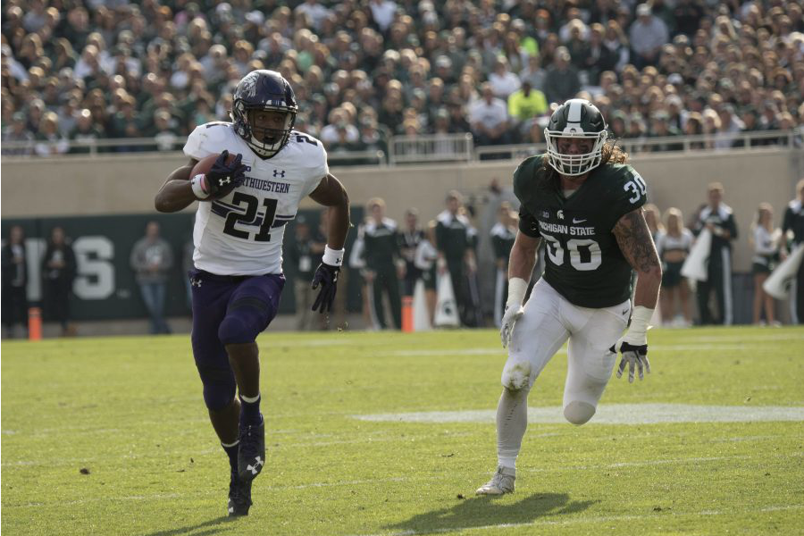 Justin Jackson carries the ball in the first half against Michigan State Saturday. The junior ran for 188 yards and two touchdowns. 