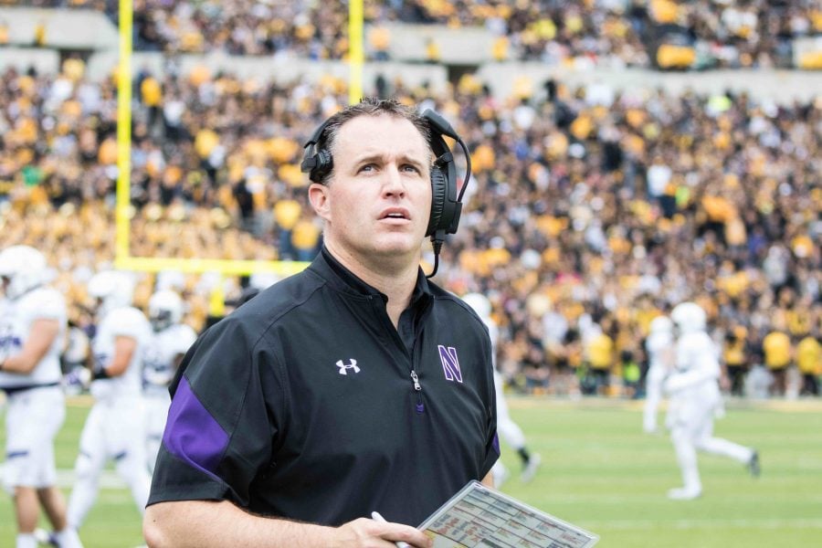 Coach Pat Fitzgerald looks up during Northwestern’s Oct. 1 game at Iowa. The teams football handbook rules were previously overbroad, according to a September NLRB advice memo.