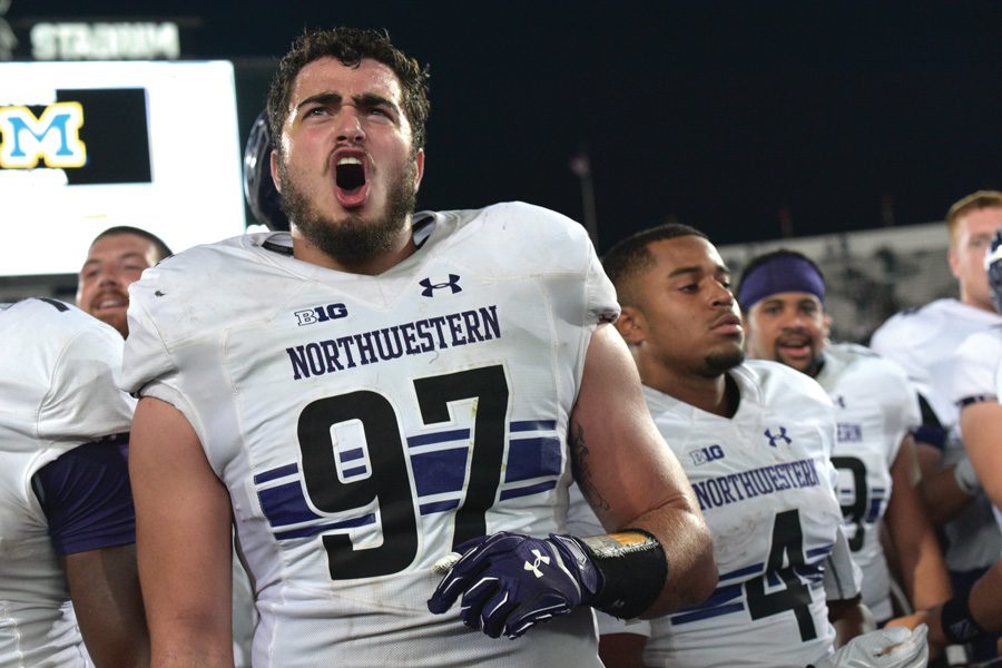 Joe+Gaziano+sings+the+fight+song+after+Northwestern%E2%80%99s+win+over+Michigan+State.+The+redshirt-freshman%E2%80%99s+sack+and+fumble+recovery+helped+shift+momentum+in+the+Wildcats%E2%80%99+victory.+