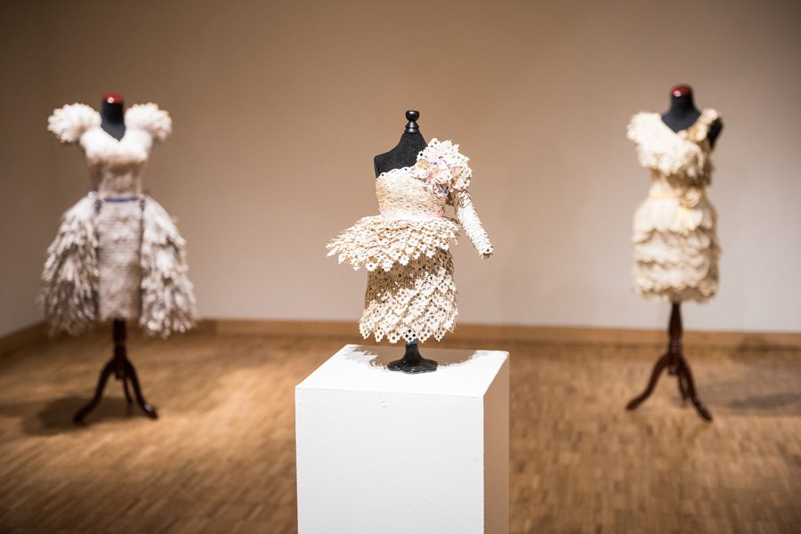 Dittmar Gallery’s new exhibit features dresses made of pages from romance novels. The dresses are a statement on feminine myths in society. 