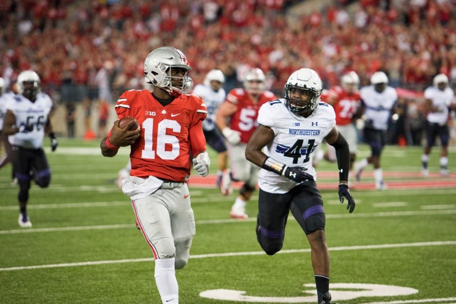 Sophomore safety Jared McGee chases after Ohio State quarterback J.T. Barrett. The Cats held Barrett to 223 passing yards and the Buckeyes to 24 points, but could not pull out the win. 