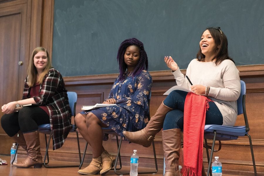 Adhana Reid (center) and theater prof. Melissa Foster (right) speak during a panel on diversity and inclusion in the Waa-Mu show at Harris Hall last month. The panelists said theater productions on campus should cast actors of color in non-stereotypical roles and represent the American population more accurately.