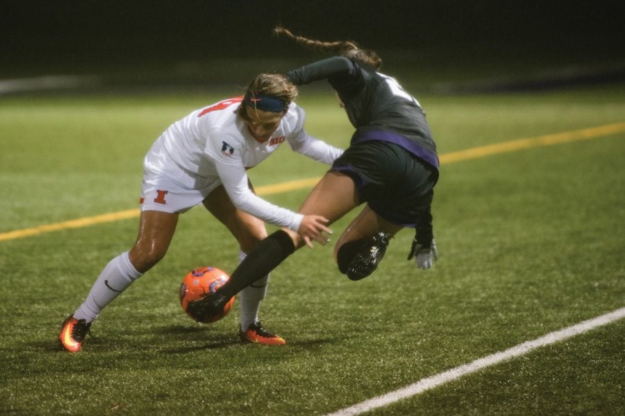 Mary Erikson is bodied off the ball. The senior midfielder and the rest of the Wildcats will be looking to improve their offensive production in the postseason.