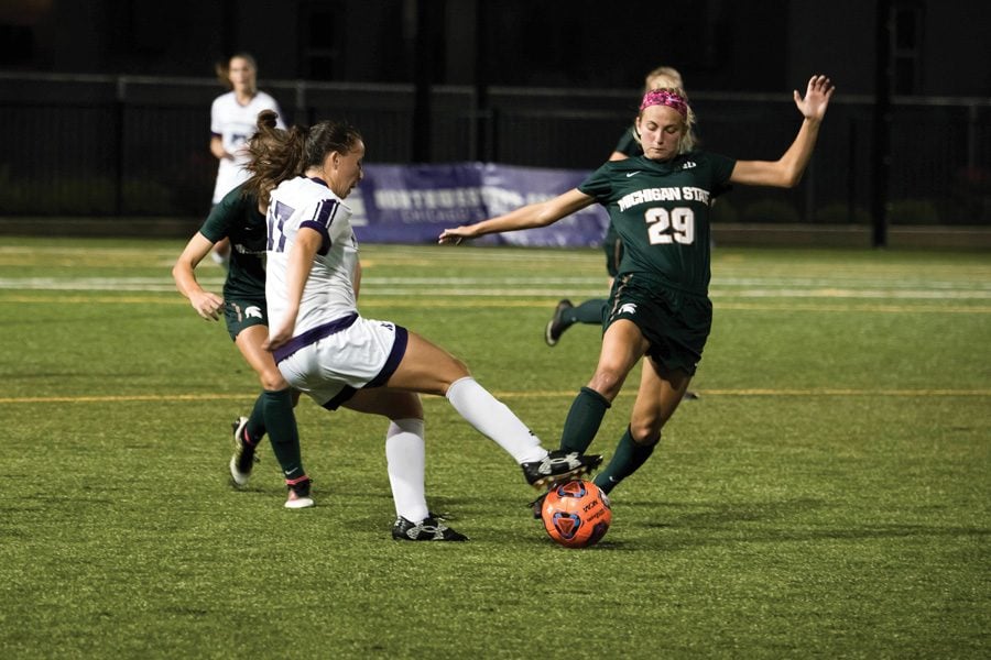 Kim Jerantowski tries to avoid defenders. The junior midfielder had two shots off the bench for Northwestern, which topped No. 19 Michigan in an emotional battle in Evanston on Sunday.