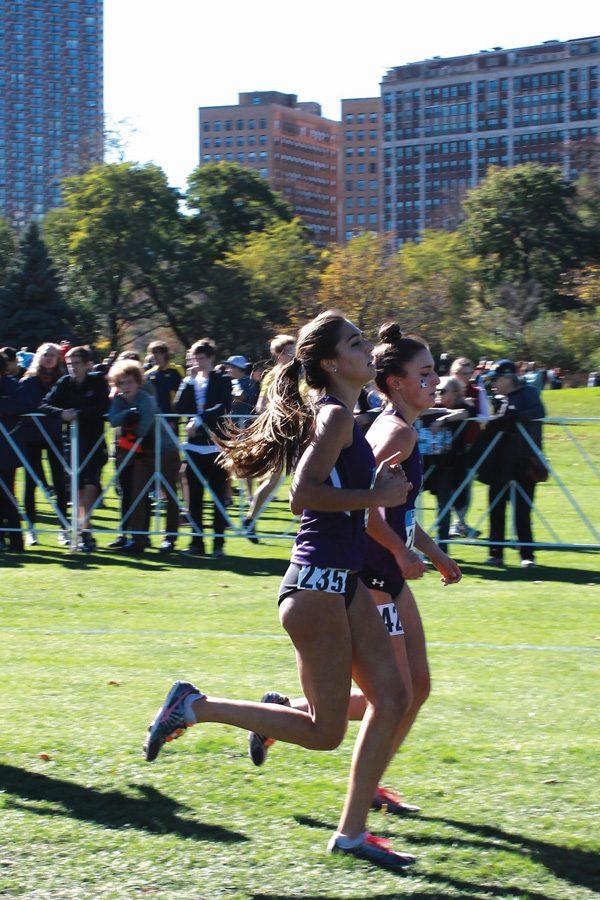 Two Wildcats run alongside each other. Northwestern struggled to a fifth-place finish at the NCAA Pre-Nationals.