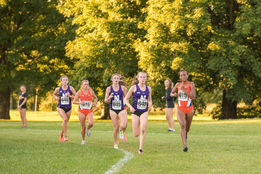 Sarah Nicholson (left-center) and Aubrey Roberts (right-center) turn a corner. The two freshmen have acquitted themselves well in their first collegiate season.