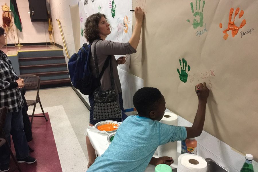 A woman and a child attend the diversity workshop held by Enrich Evanston in October. Enrich Evanston aims to increase diversity and inclusion efforts within the Evanston arts. 