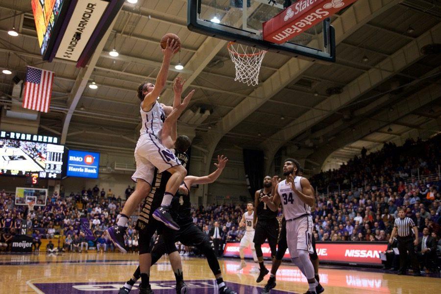 Gavin Skelly lays the ball in. The junior forward scored 11 points off the bench as the Wildcats held off Wake Forest.