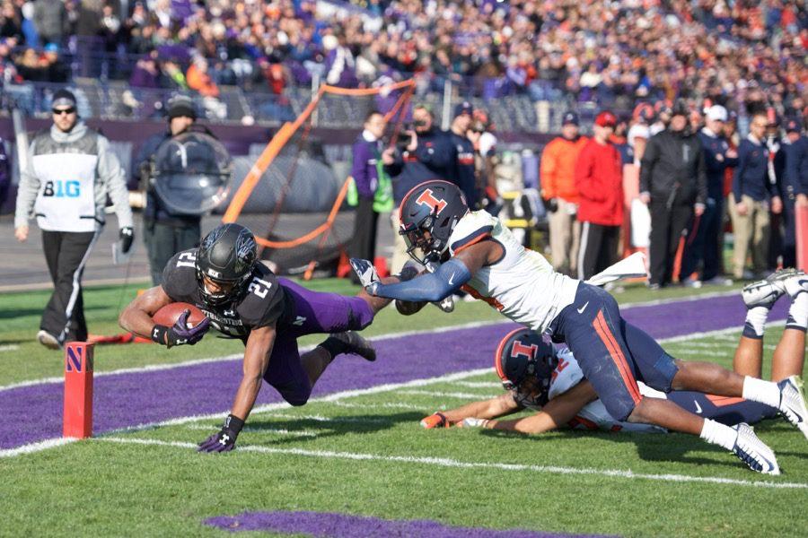 Justin Jackson dives into the end zone. The junior running back rushed for 173 yards and three touchdowns against Illinois. 
