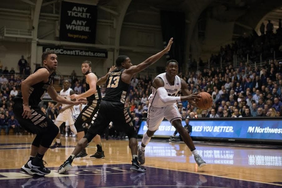 Scottie Lindsey drives to the hoop. The junior guard led NU with 19 points.