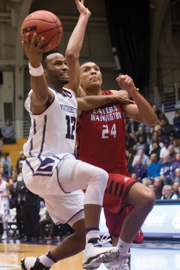 Isiah Brown attempts a layup. The guard’s strong start helped keep NU competitive in the opening half. 
