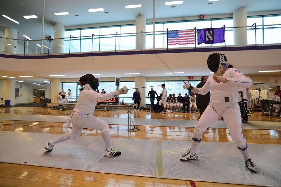 Katie Van Riper fences against an opponent. The junior went 9-3 in the Cats’ big weekend.