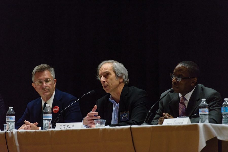 Mayoral candidates Mark Tendam (left), Jeff Smith (center) and Gary Gaspard (right) talk Thursday night at an election forum at Chute Middle School, 1400 Oakton St. The forum was intended to increase awareness about mayoral and aldermanic candidates ahead of the upcoming elections.