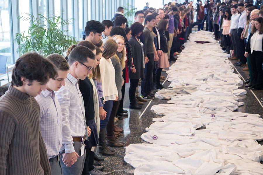 Feinberg students and faculty lay down their white coats in support of the Affordable Care Act. The demonstration was held in Chicago on Monday.