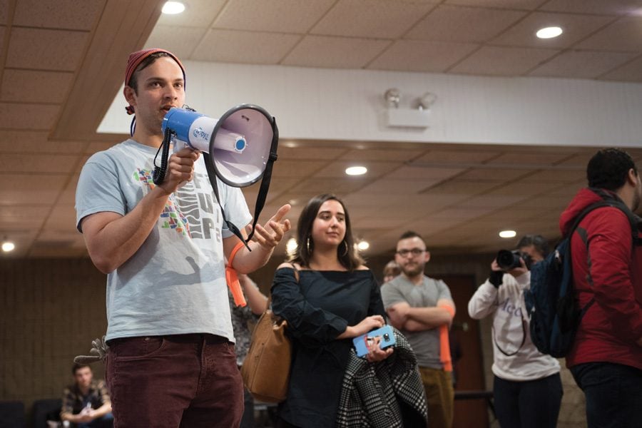 (Allie Goulding/The Daily Northwestern) Zane Waxman (SESP ’16) addresses a group of students at Norris University Center on Friday. Student Action NU organized the protest in response to the presidential inauguration of Donald Trump.