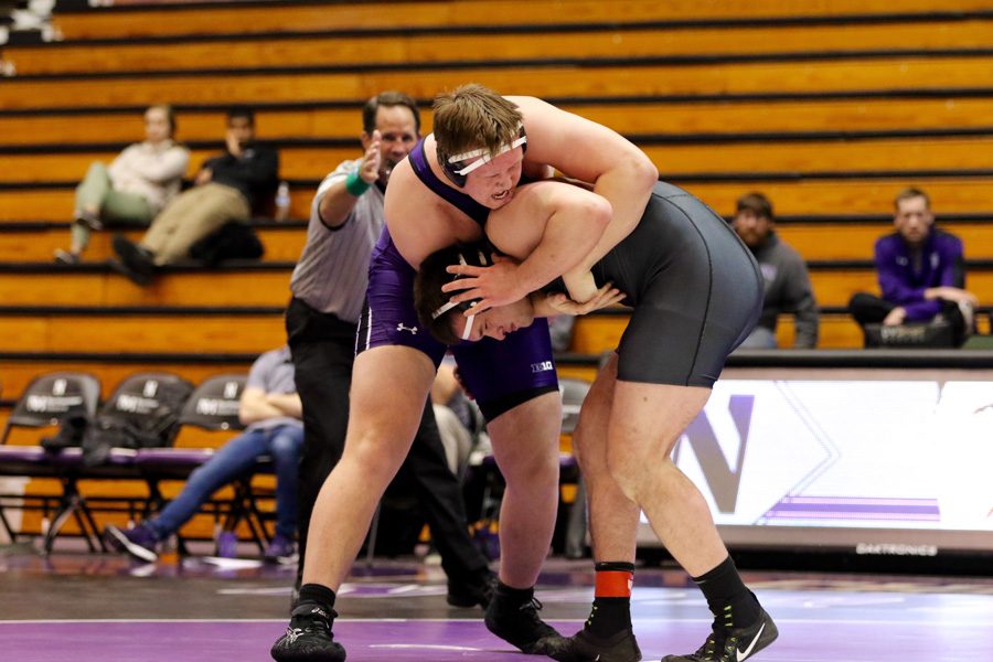 Conan Jennings grapples with an opponent. The sophomore’s victory Sunday wasn’t enough for the Wildcats.