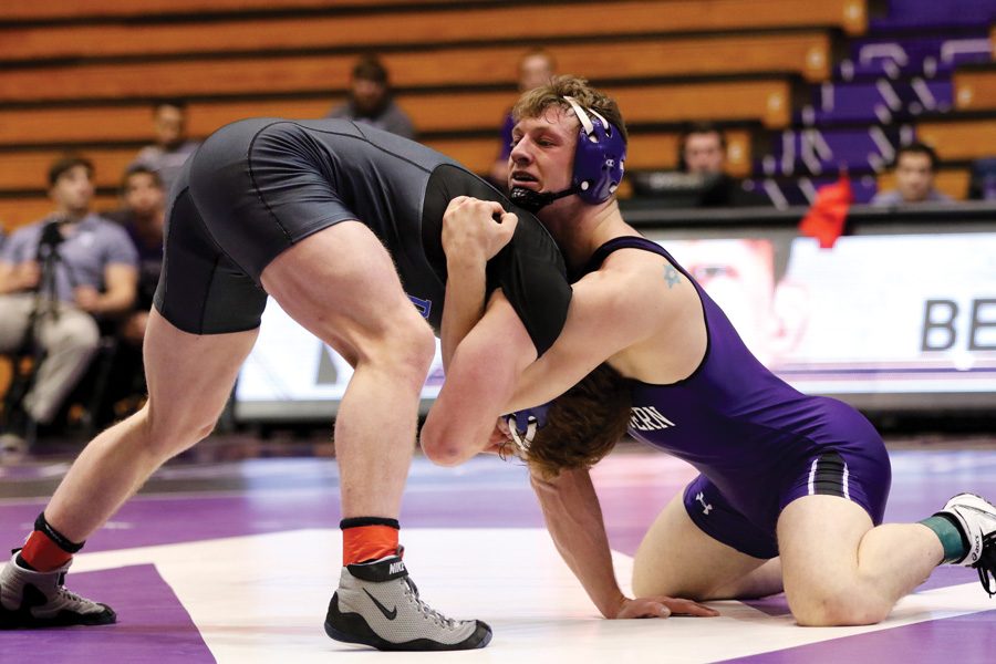 (Daily file photo by Keshia Johnson) Jacob Berkowitz grapples with an opponent. The senior has emerged as a key wrestler for NU this season.