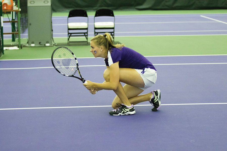Erin Larner kneels before a point. The junior will look to lead Northwestern through a packed weekend in Durham.