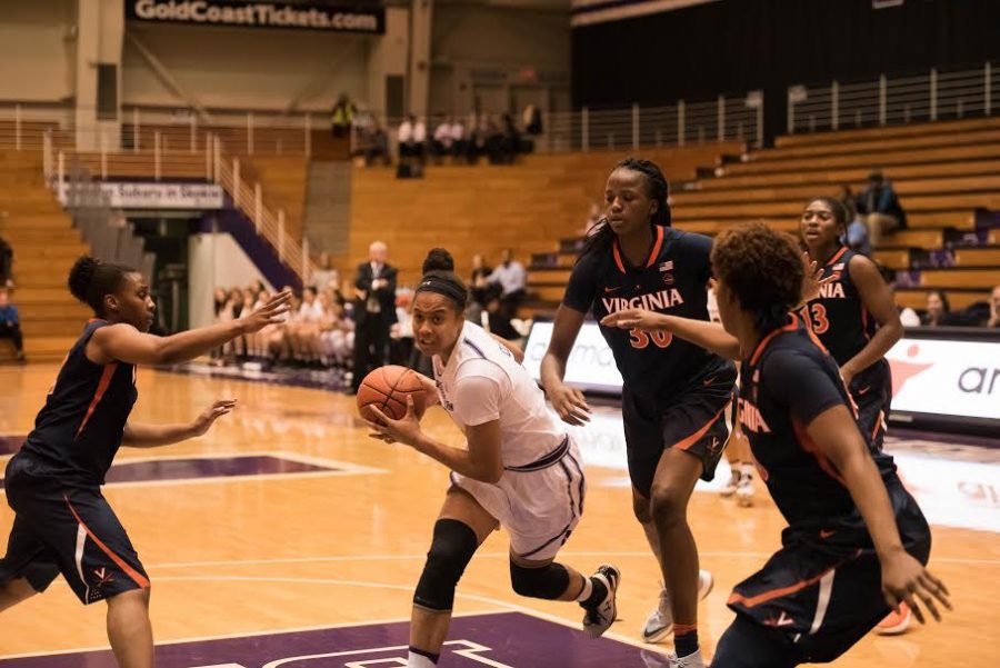 Nia Coffey drives through the paint. The senior made conference history but couldnt lift NU over Maryland on Saturday.