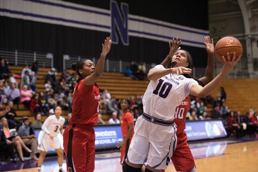 Nia Coffey attempts a shot. The senior forward notched 19 points but couldn’t lift Northwestern over the Boilermakers, who won on a buzzer-beater.
