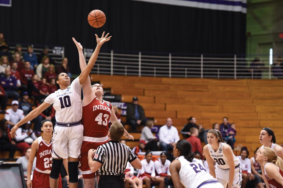 Nia Coffey competes for a jump ball. The seniors 33-point effort was wasted in Mondays loss to Minnesota.