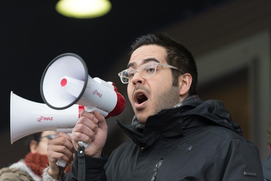 A member of the Iranian Student Association speaks at a protest Wednesday against President Donald Trump’s immigration executive order. Students from Muslim-majority countries targeted by Trump’s actions expressed concern and fear following the order.