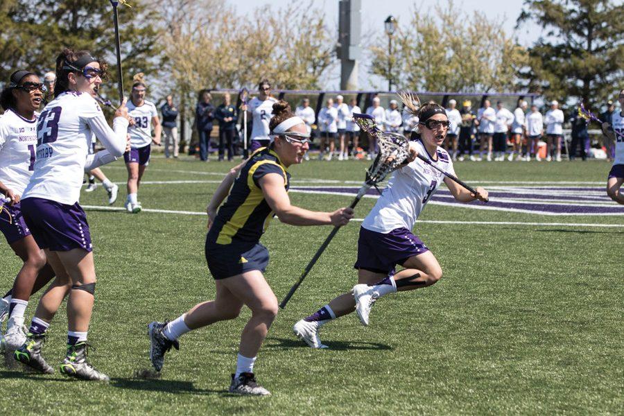Christina Esposito runs past an opponent. The senior scored four goals in Northwestern’s loss to Colorado.
