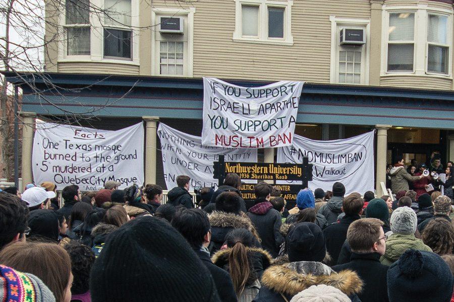 Protesters gather outside of the Multicultural Center for a demonstration against President Donald Trump’s executive order barring citizens of seven Muslim-majority countries from entering the country. University President Morton Schapiro said it is important to focus on Muslim voices regarding the protest and not to be distracted by other conversations.