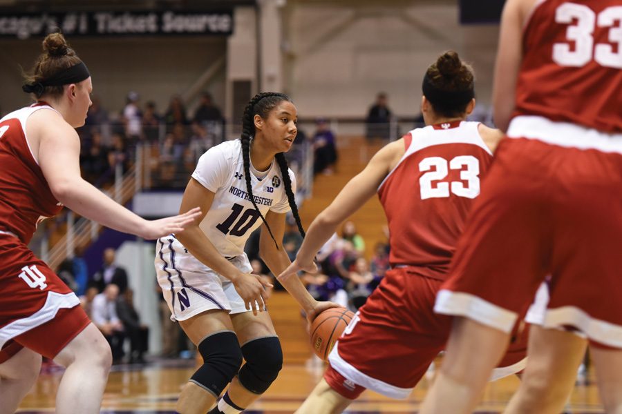 Nia Coffey dribbles through defenders. The senior will look to lead Northwestern through its home stretch.

