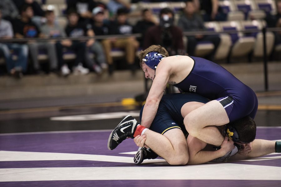 Jacob Berkowitz grapples with his opponent. The senior will close out his home career on Senior Day this weekend.
