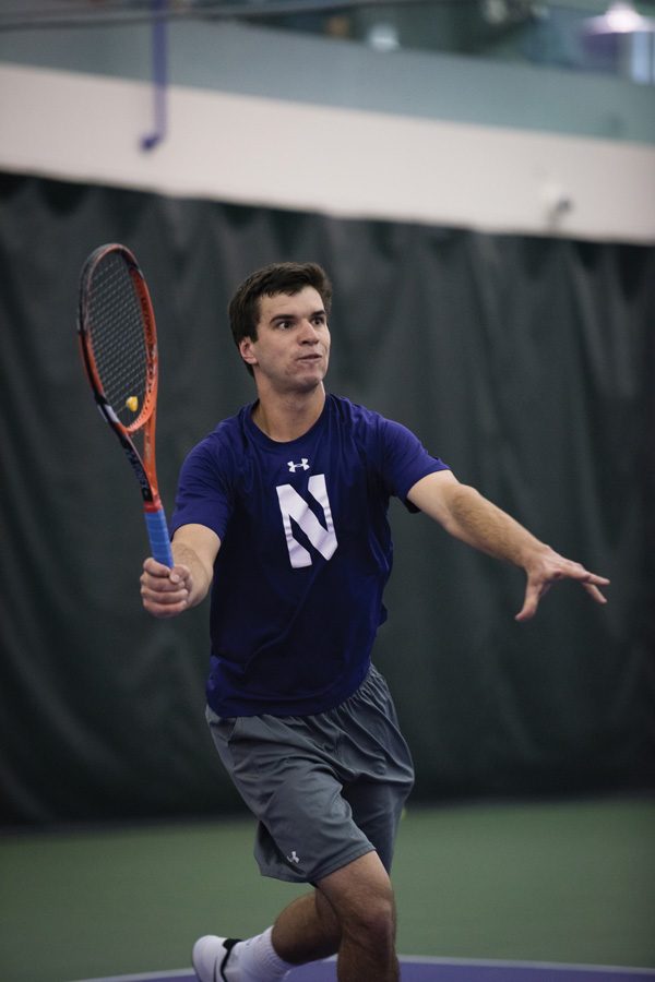Konrad Zieba lunges forward for a volley. The senior looks to lead the Wildcats to a pair of road wins in tricky conditions this weekend.