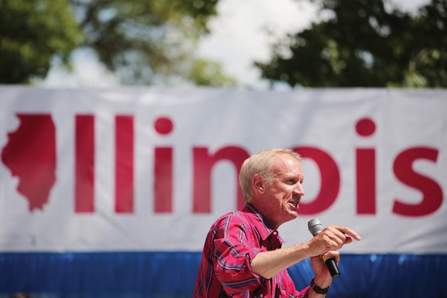 Illinois Gov. Bruce Rauner speaks in Springfield on Aug. 17. Senate Democrats accused Rauner of interfering in the “grand bargain” bills voting this week. 