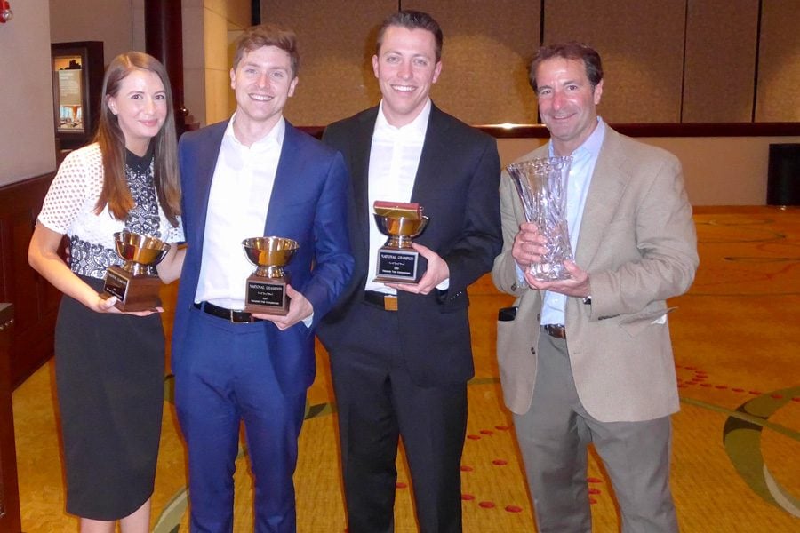 Members of NU’s Pritzker School of Law team Stacy Kapustina, Garrett Fields and Douglas Bates, and coach Richard Levin pose with awards. The team won their fifth National Trial Competition championship title in Fort Worth, Texas.