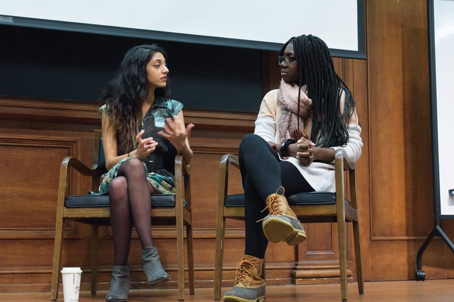 Associated Student Government president and executive vice president candidates Nehaarika Mulukutla and Rosalie Gambrah talk during a town hall co-hosted by ASG and Political Union. The two said the University should provide more funding for programs to support sexual assault survivors. 