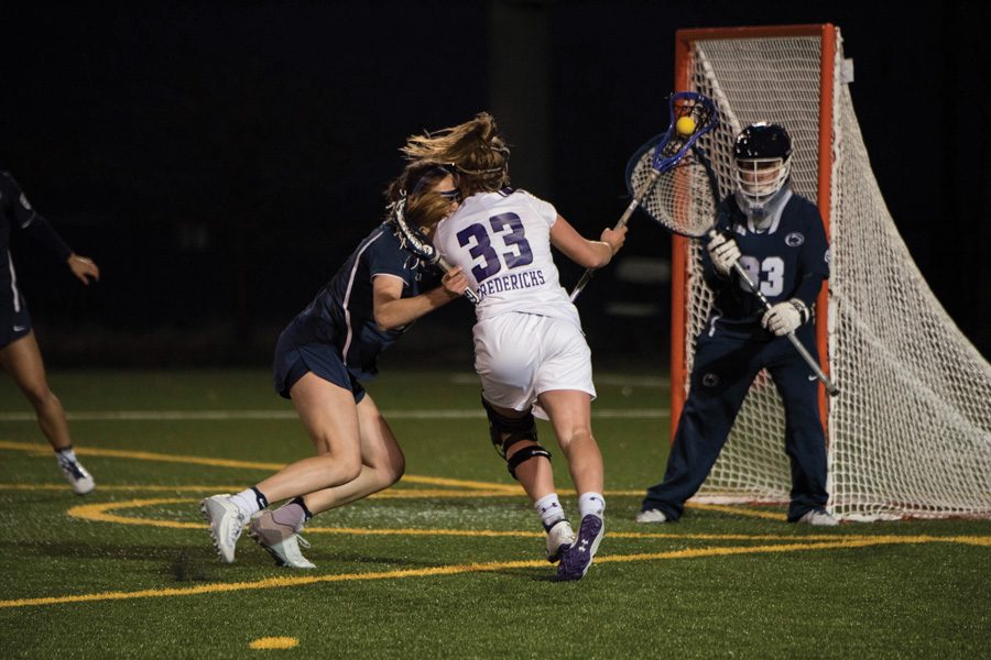 Shelby Fredericks fights against a defender. The junior attacker set a program record with 17 draw controls, but the Wildcats lost a thriller against Penn State.