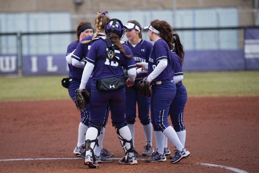 Several Wildcats converse in the circle. Northwestern was shut down in a series sweep at Minnesota this weekend.