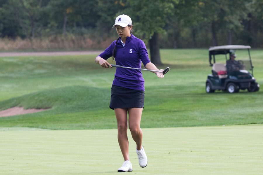 Janet Mao carries her putter. The sophomore and the Wildcats blew an eight-stroke lead in the final round of the Big Ten Tournament.