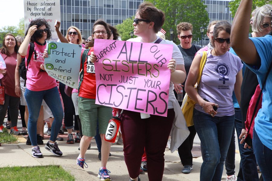 People march in Springfield on Tuesday. More than 1,000 people joined the Illinois Women March on Springfield to demand for more progressive legislation.