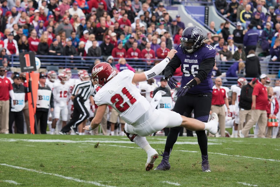 Xavier Washington makes a tackle. The Northwestern football player was arrested Sunday in connection with drug possession charges.