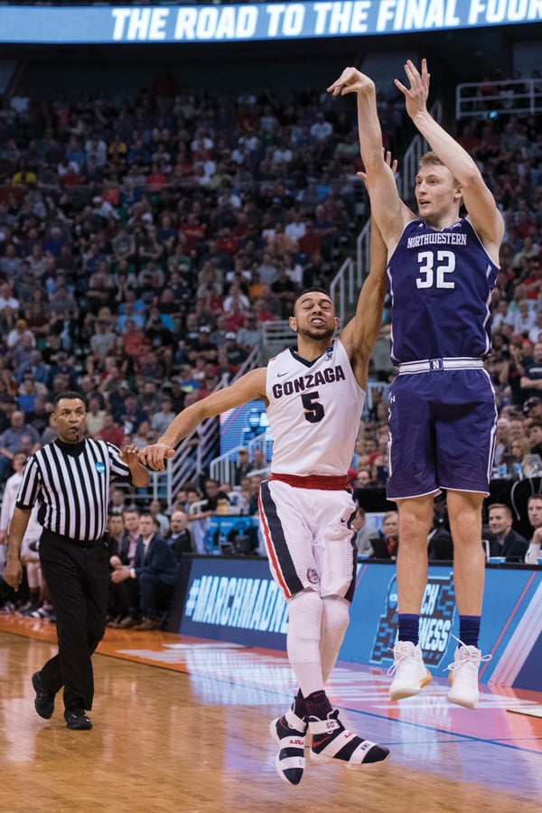 Nathan Taphorn fires a 3-pointer in the NCAA Tournament. Taphorn was a 3-point specialist for most of his NU career.
