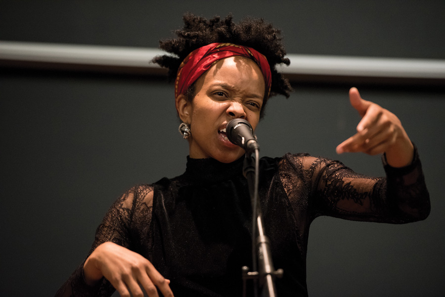Chicago hip-hop artist Jamila Woods performs at an event hosted by Northwestern Community Development Corps in Fisk Hall on Wednesday. Woods was part of a panel that discussed hip-hop and social activism. 